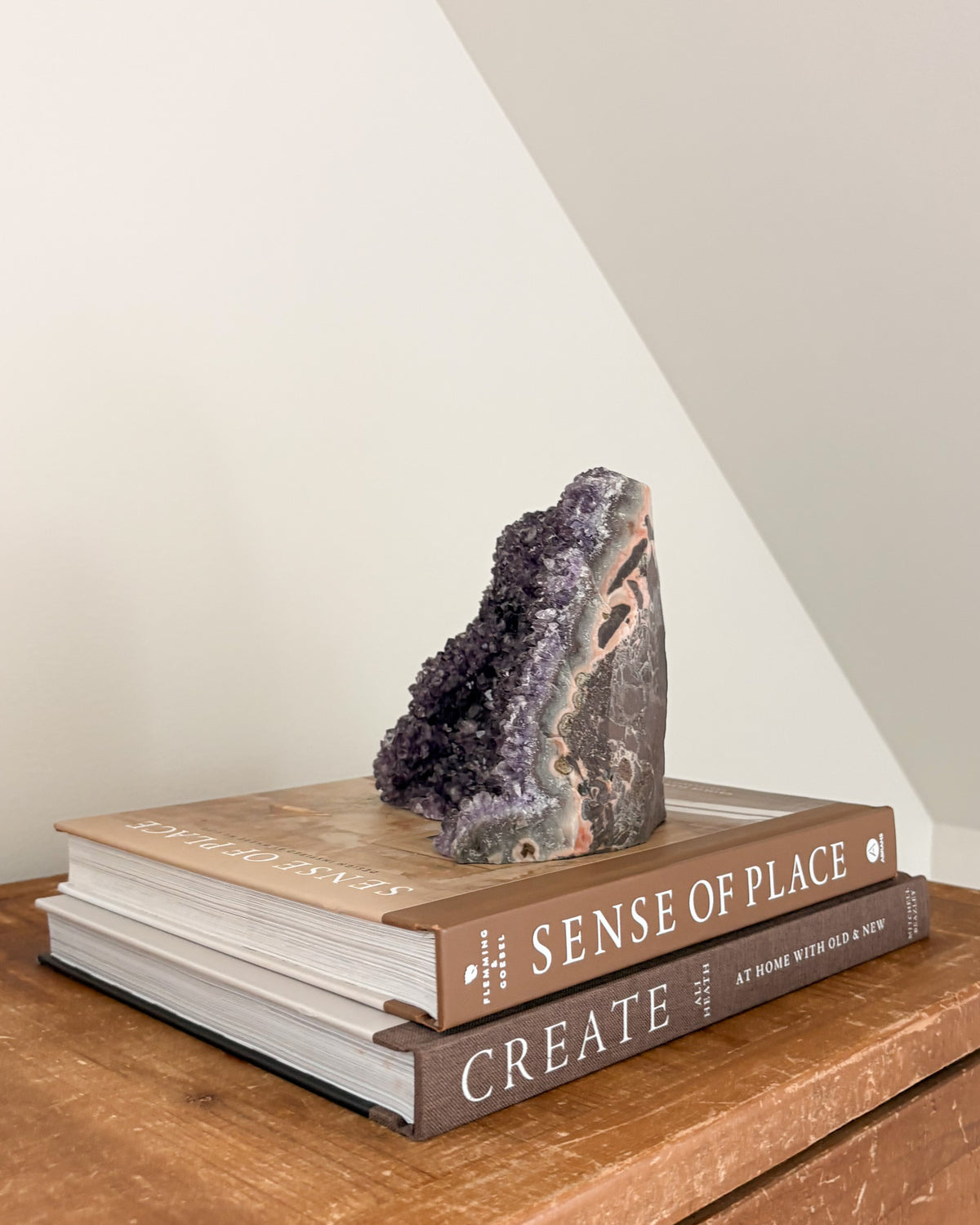 Upright rainbow amethyst geode with flat base for display
