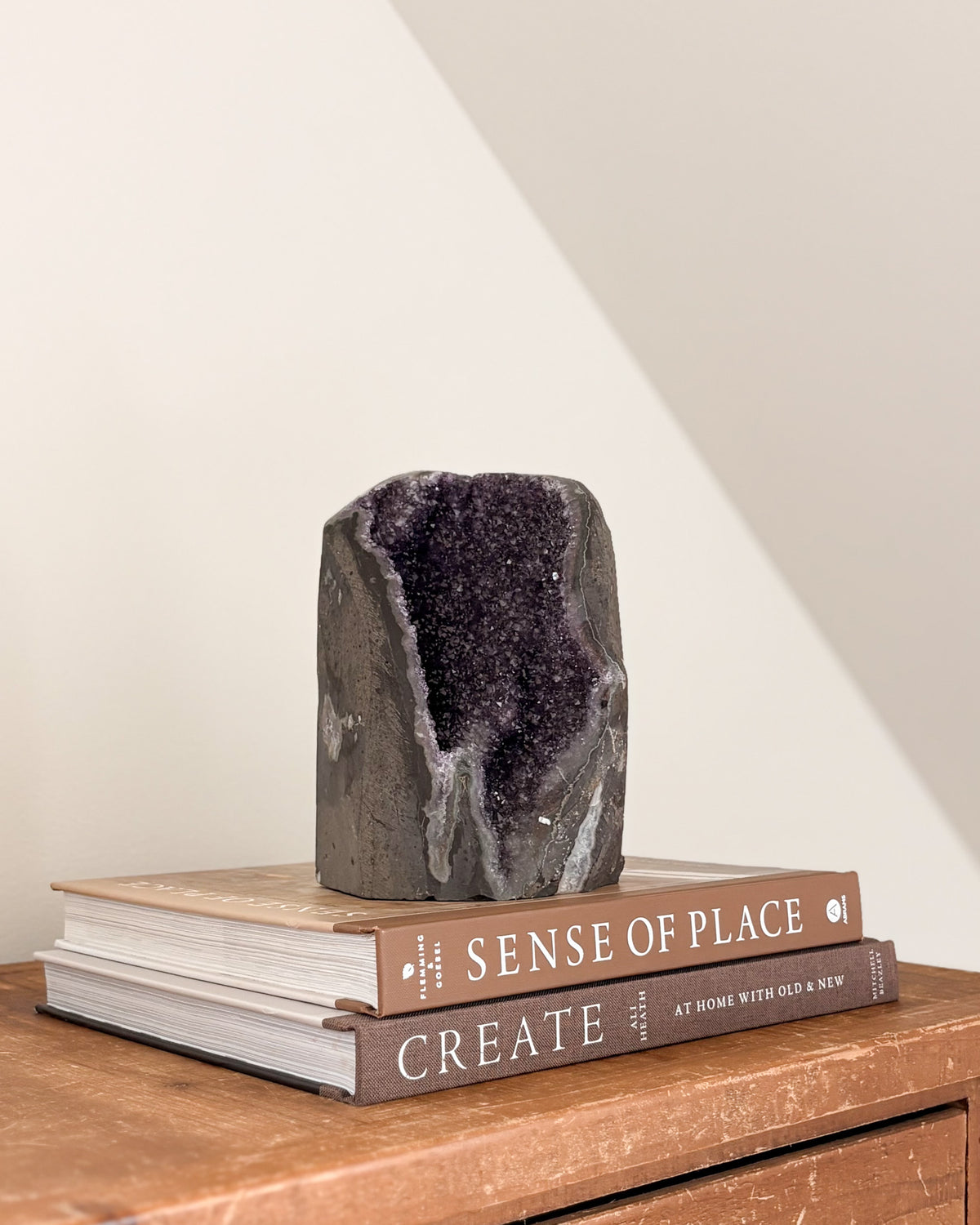 Rainbow amethyst geode with purple crystalline interior