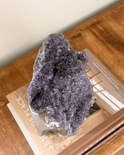 Rainbow amethyst geode showing natural crystal detail
