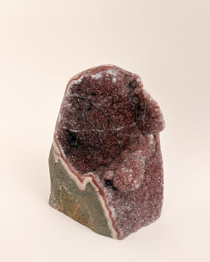 One-of-a-kind amethyst geode featuring fine druzy crystals and earthy mineral tones