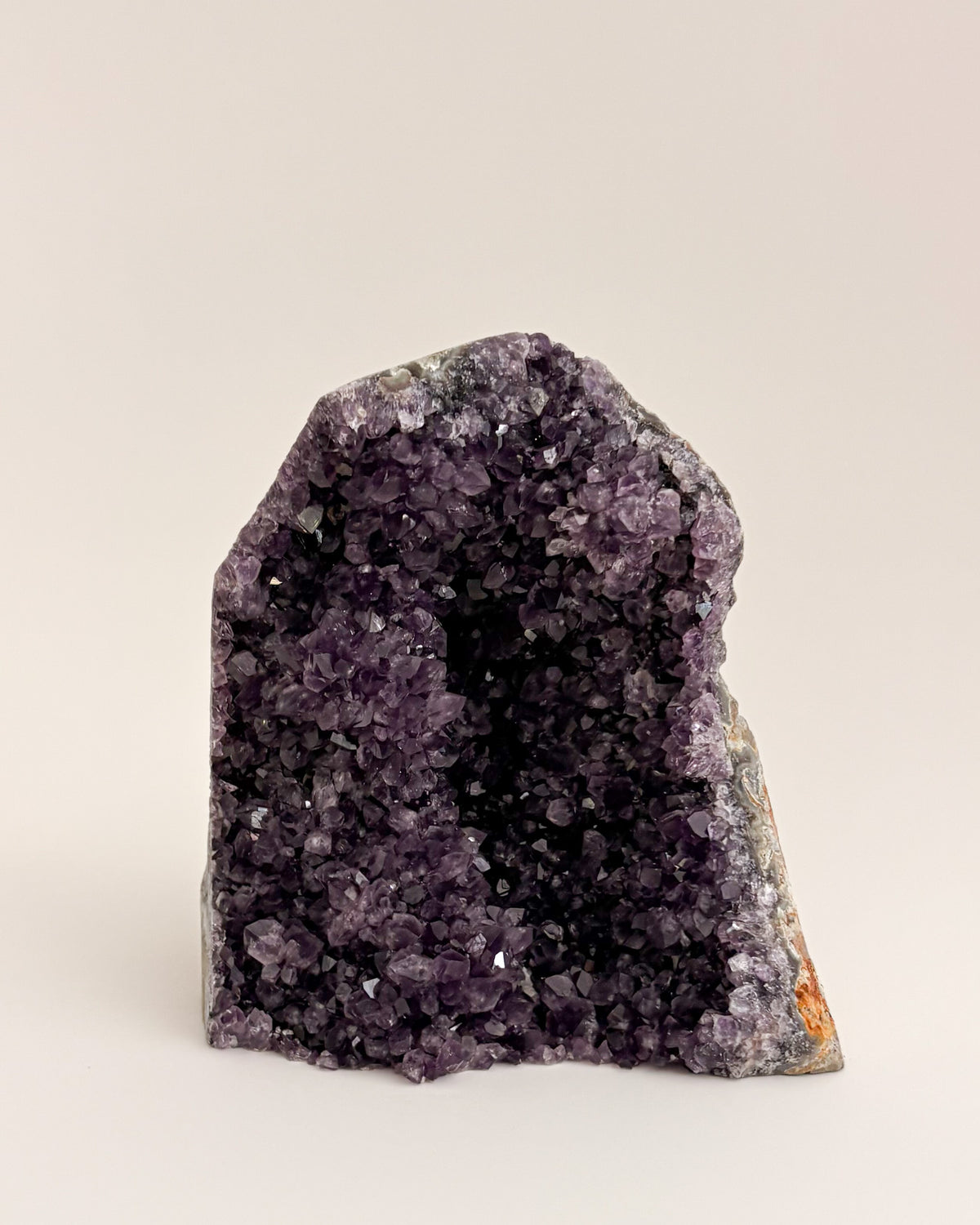 Freestanding amethyst crystal geode with delicate lavender and smoky purple tones