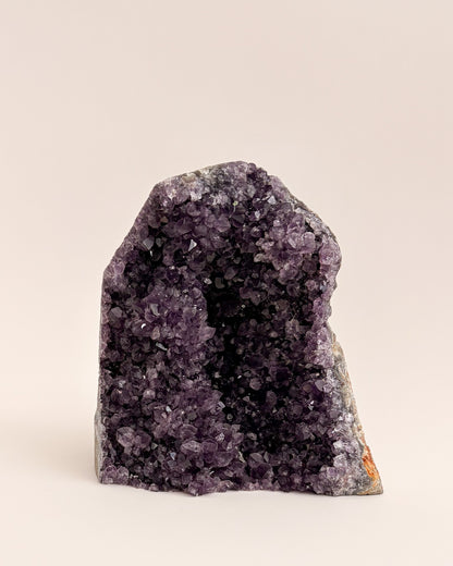 One-of-a-kind amethyst geode featuring fine druzy crystals and earthy mineral tones
