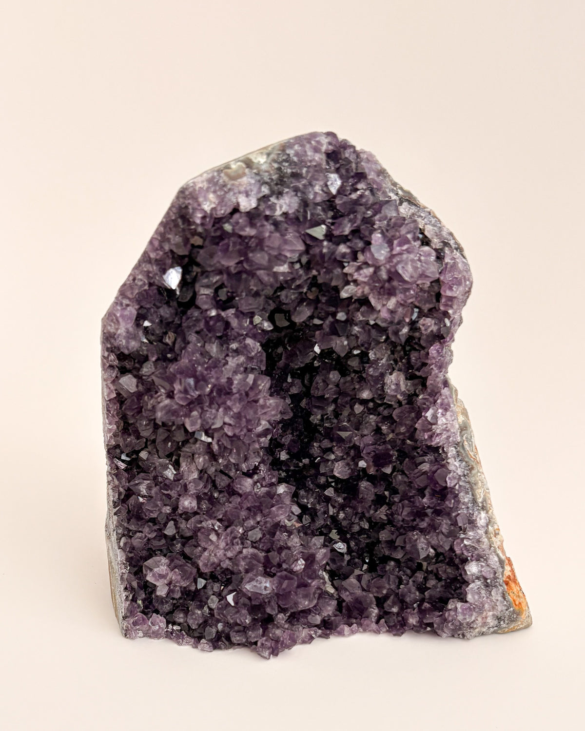 Natural amethyst geode displaying a crystalline interior and distinctive agate banding