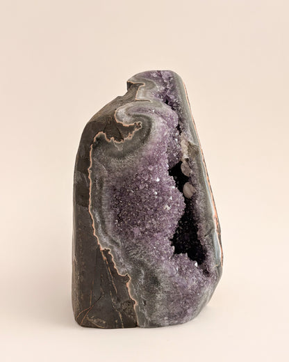 One-of-a-kind amethyst geode featuring fine druzy crystals and earthy mineral tones