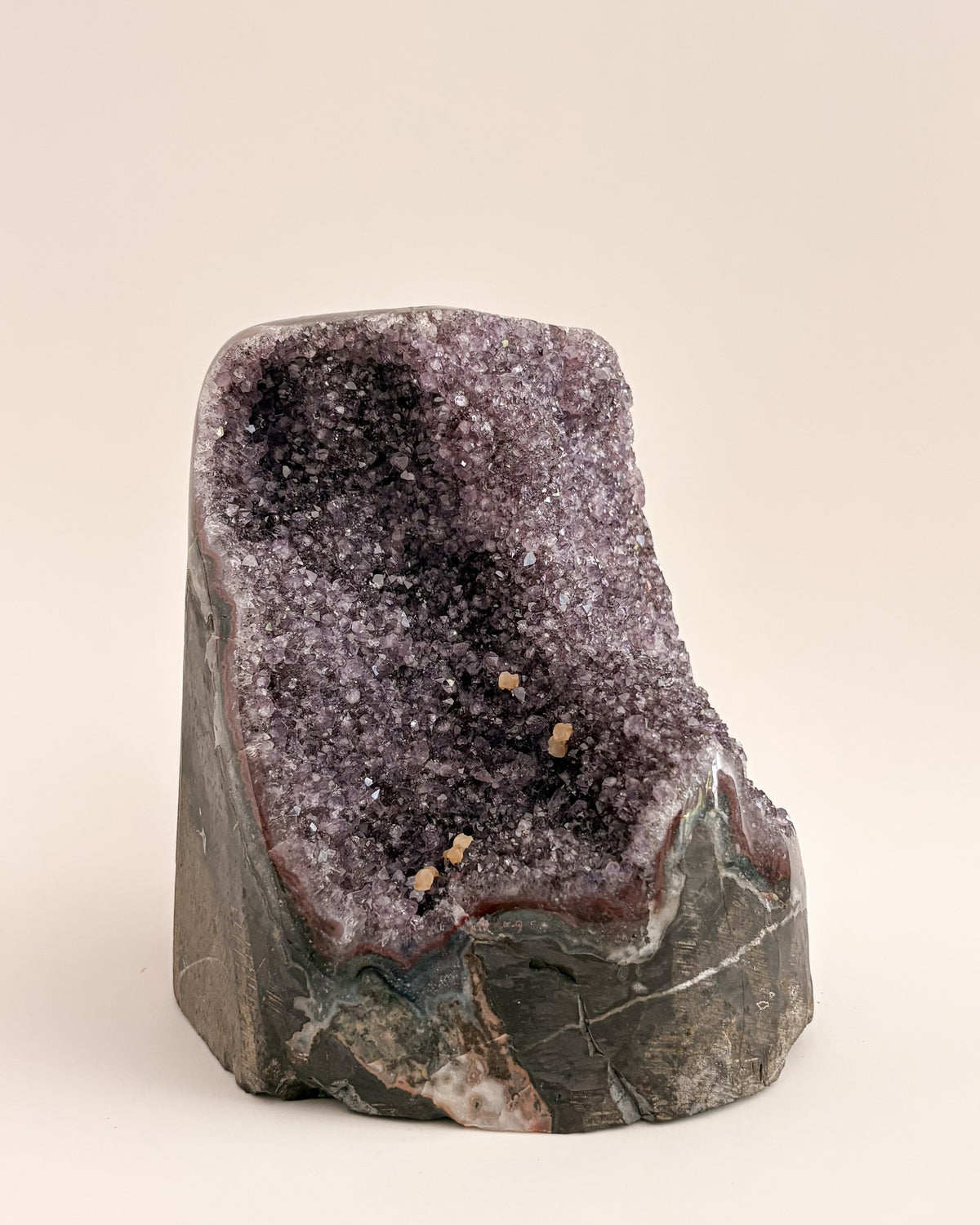 Freestanding amethyst crystal geode with delicate lavender and smoky purple tones