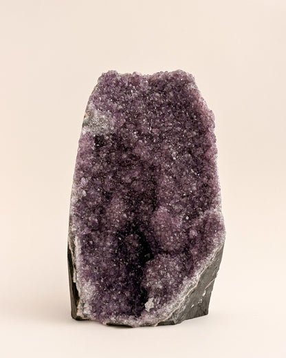 Freestanding amethyst crystal geode with delicate lavender and smoky purple tones