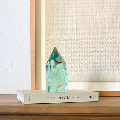Aqua glass crystal decor accent on book stack