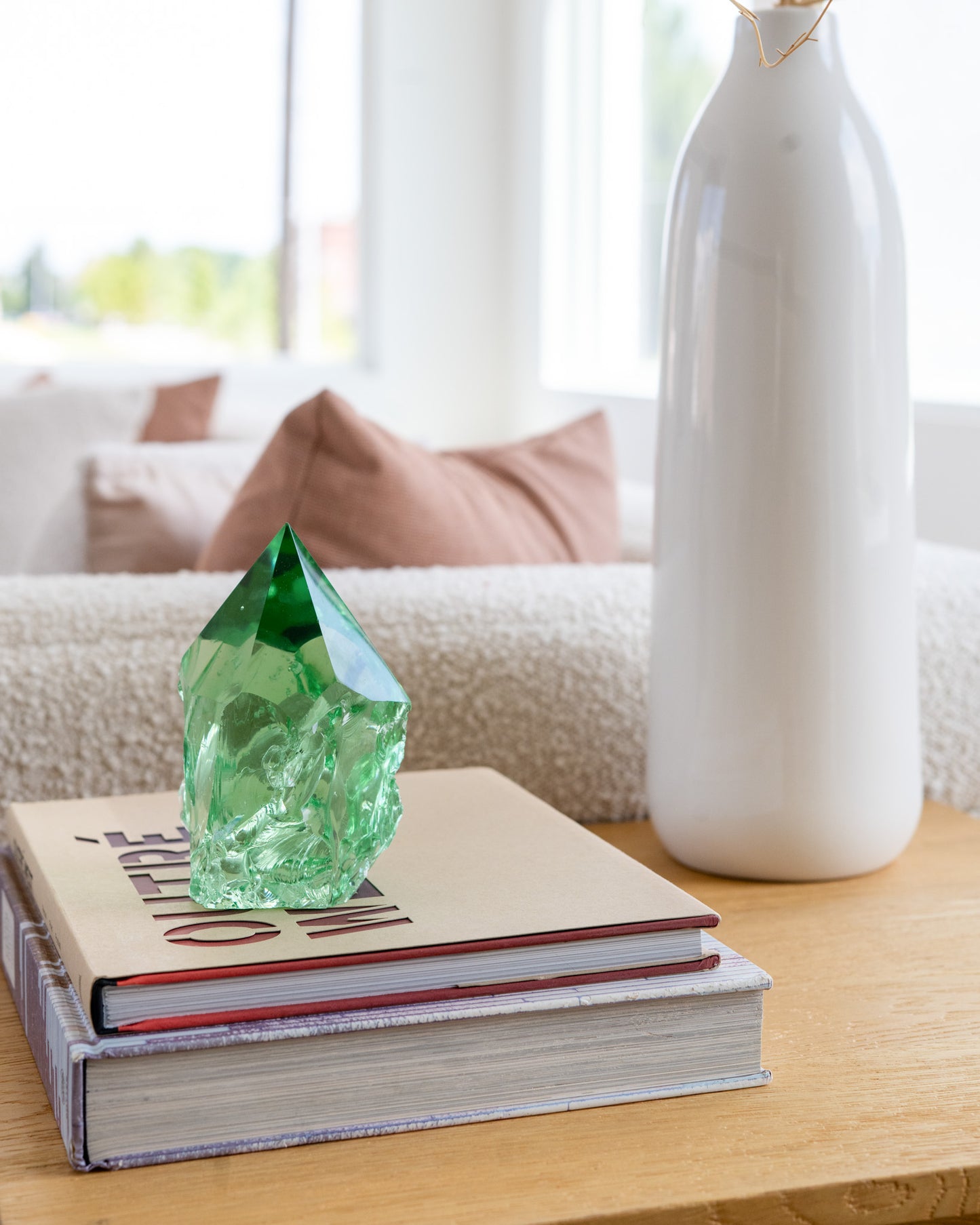 Emerald green glass point decorative object styled in a modern rustic living room