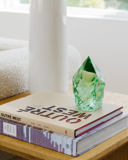 Rustic green glass point home decor accent in a light-filled neutral interior
