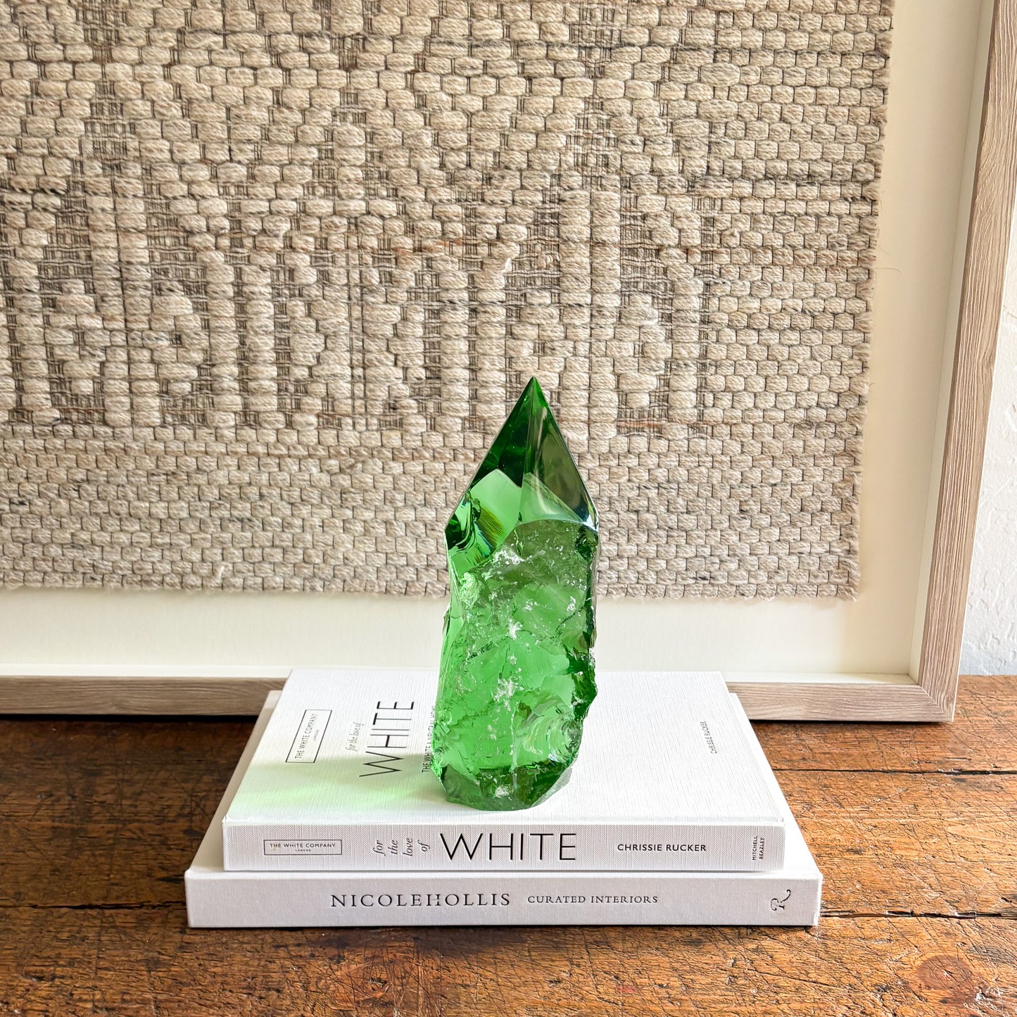 rustic emerald green glass crystal point decor on stacked books