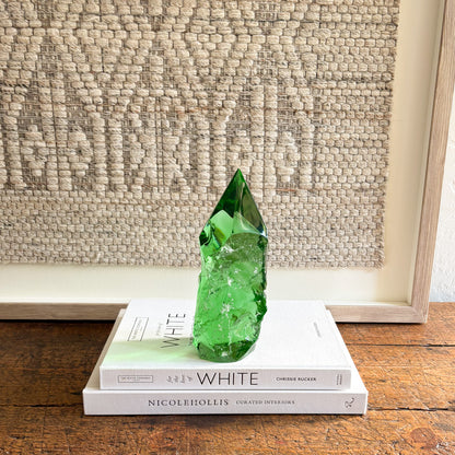 rustic emerald green glass crystal point decor on stacked books