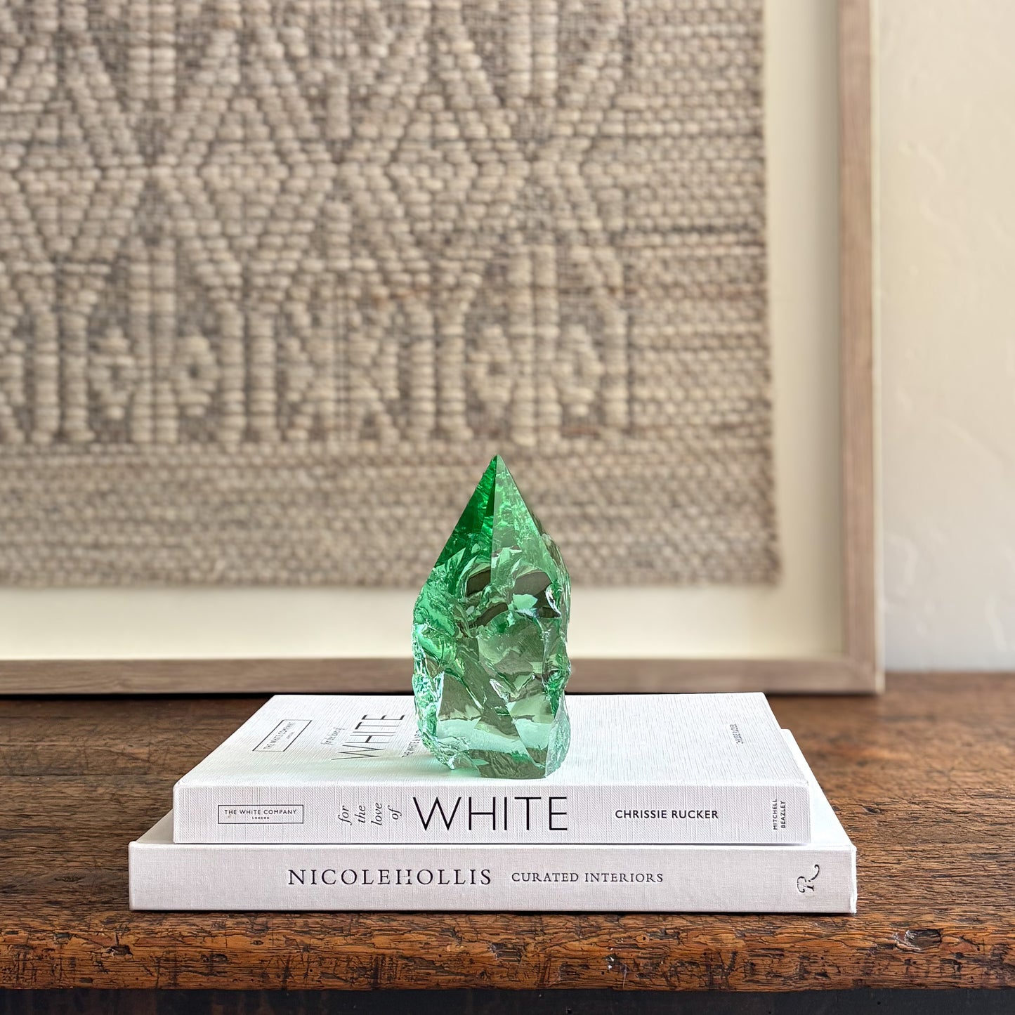 Artisan green glass point styled on neutral design books