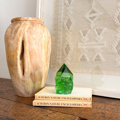 Rustic green glass crystal point styled on vintage books for shelf decor