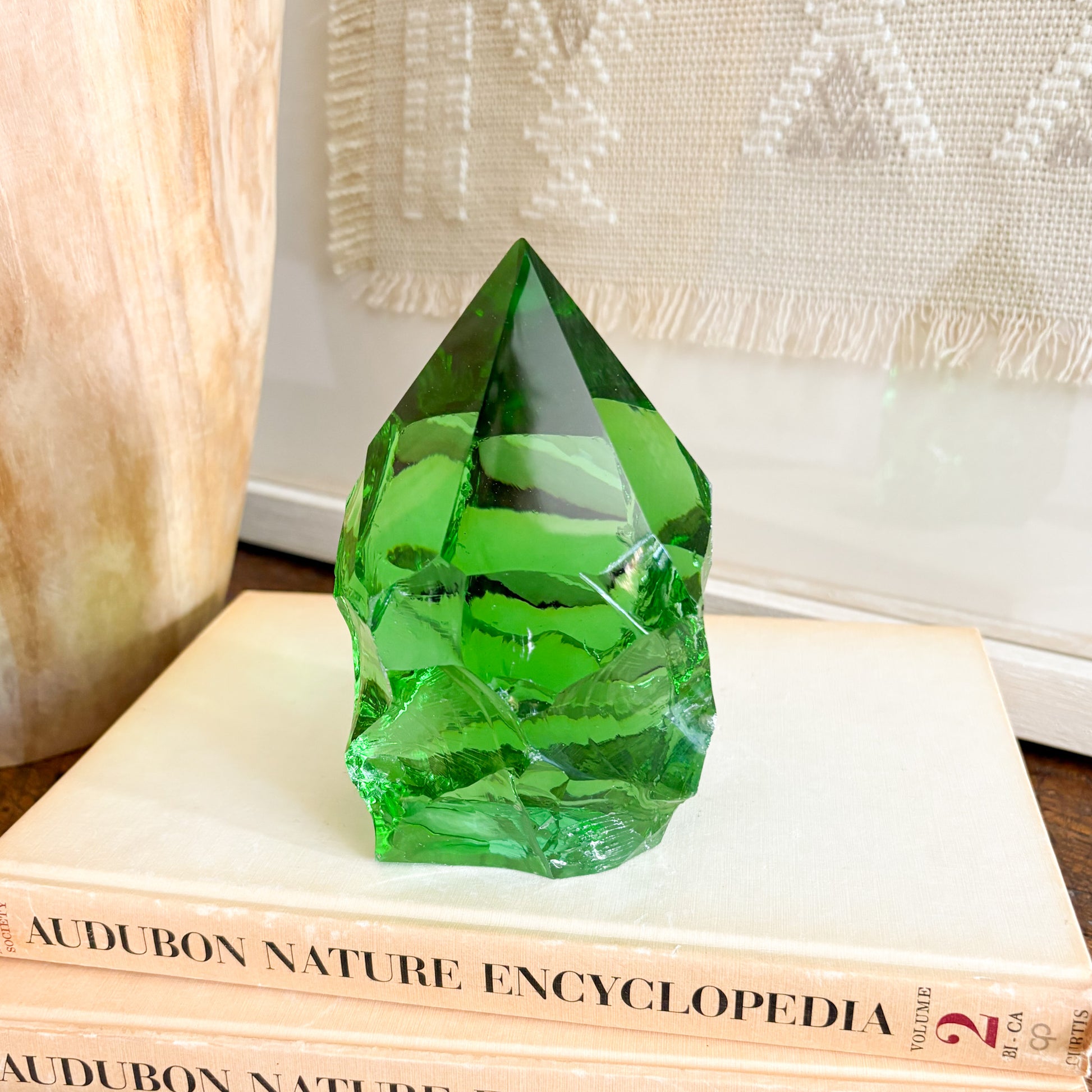 Rustic green glass crystal point styled on vintage books for shelf decor