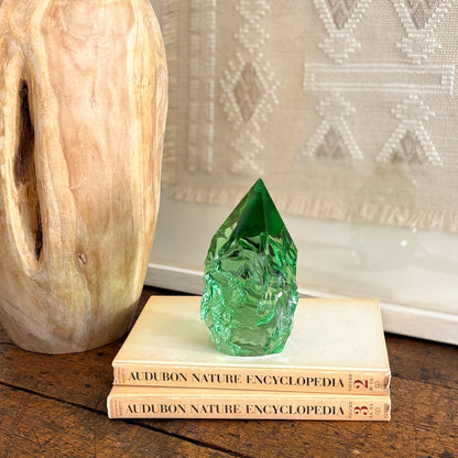 Decorative rustic green glass point on Audubon Nature Encyclopedia book stack