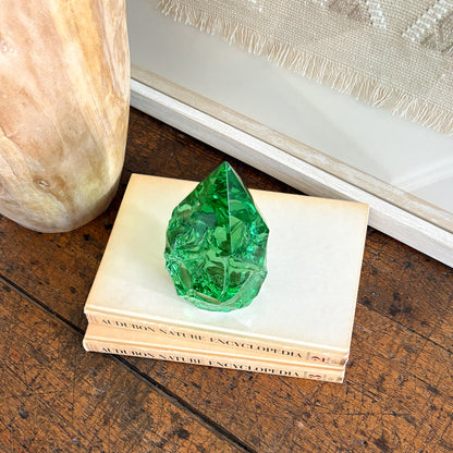 Rustic green glass crystal point styled on vintage books for shelf decor