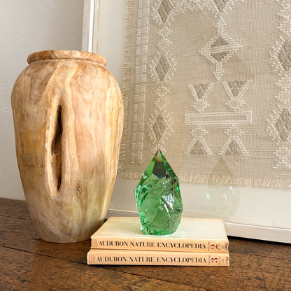 Emerald green glass point home decor styled with vintage book stack