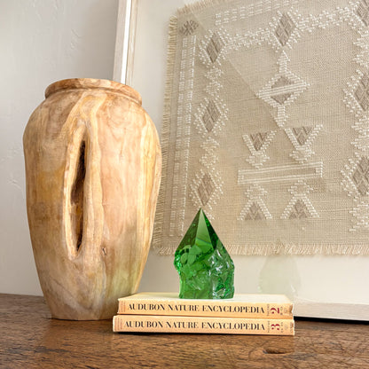 Rustic green glass crystal point styled on vintage books for shelf decor
