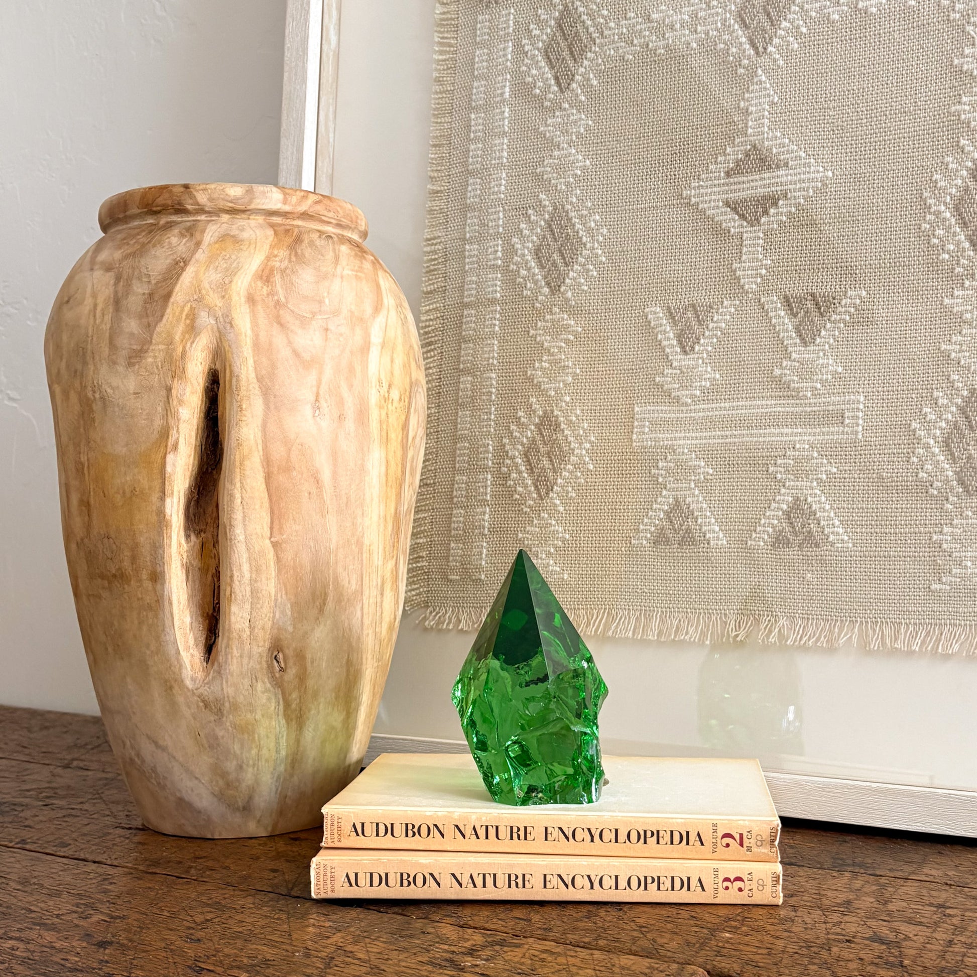 Decorative rustic green glass point on Audubon Nature Encyclopedia book stack