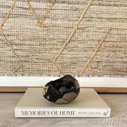 Septarian druzy egg on a shelf as earthy crystal home decor