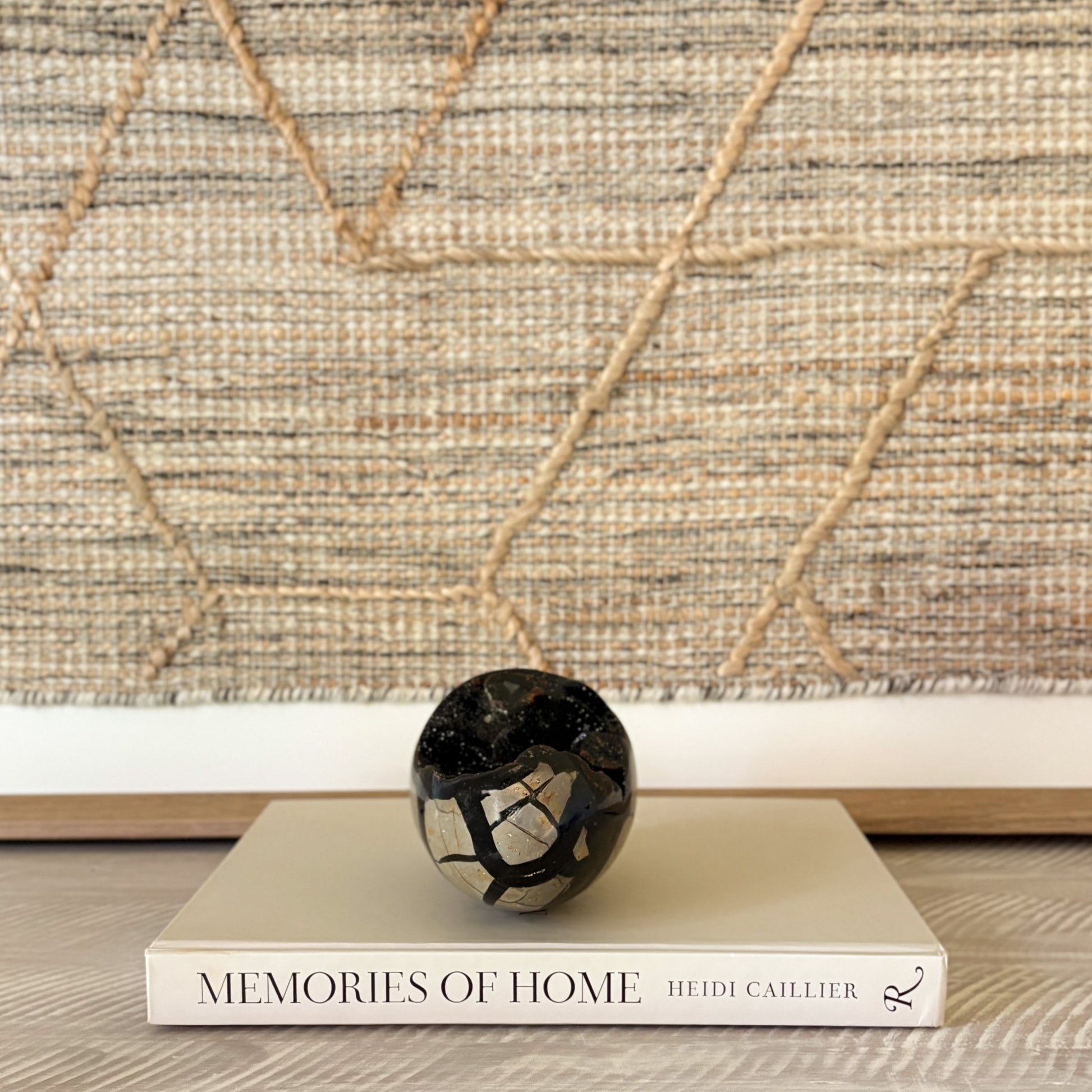 Decorative septarian druzy egg, tan and black with glittering crystal cavities