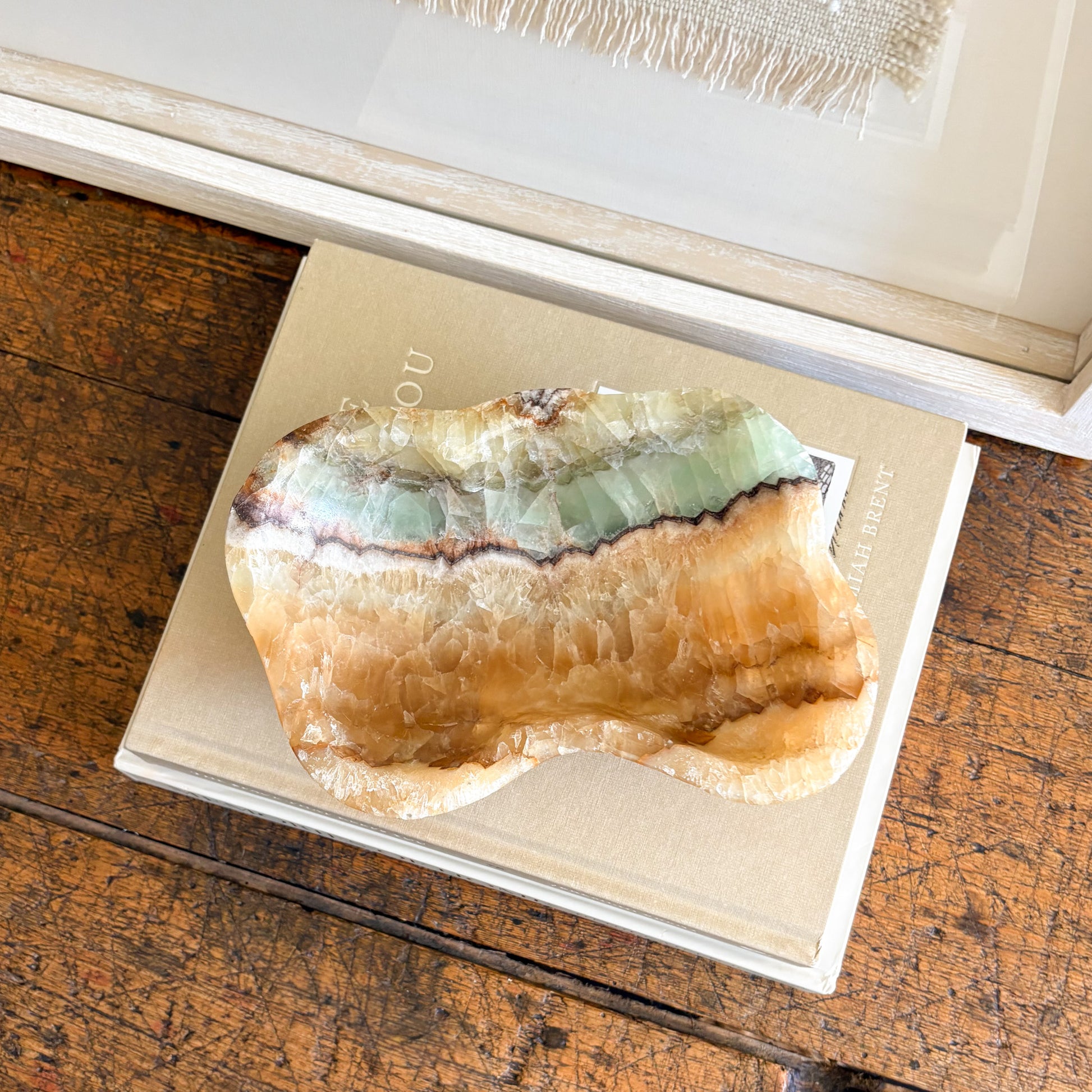 Natural serpentine onyx bowl used as a sculptural object in modern home decor