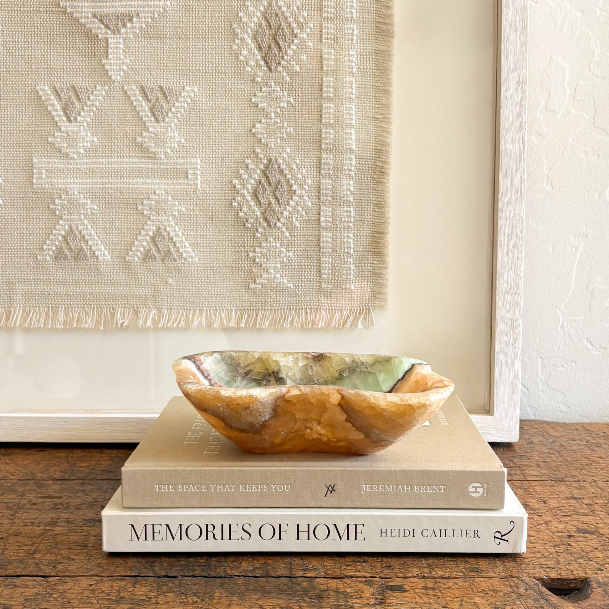 Close-up of serpentine onyx bowl showing natural green banding and polished stone texture
