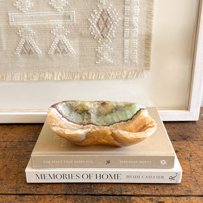 Textured onyx stone bowl highlighting natural veining and translucent mineral layers