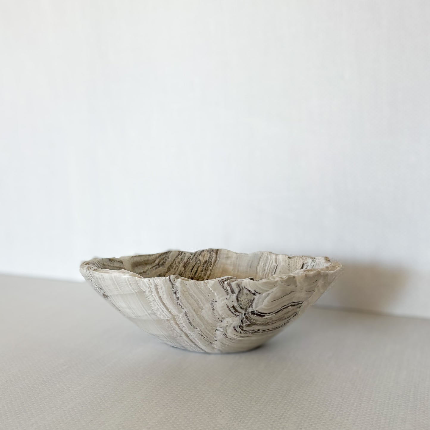 Minimalist hand-carved stone bowl made from grey onyx