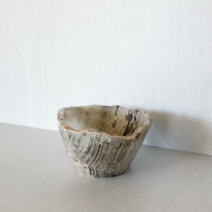 Natural grey onyx bowl used as jewelry catchall