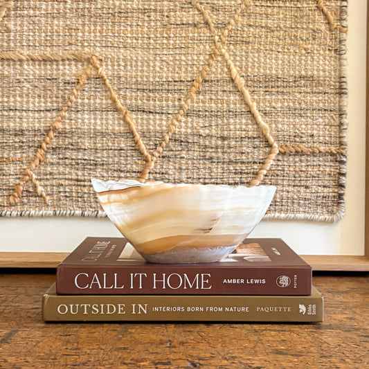 Small hand-carved amber onyx bowl with warm golden tones