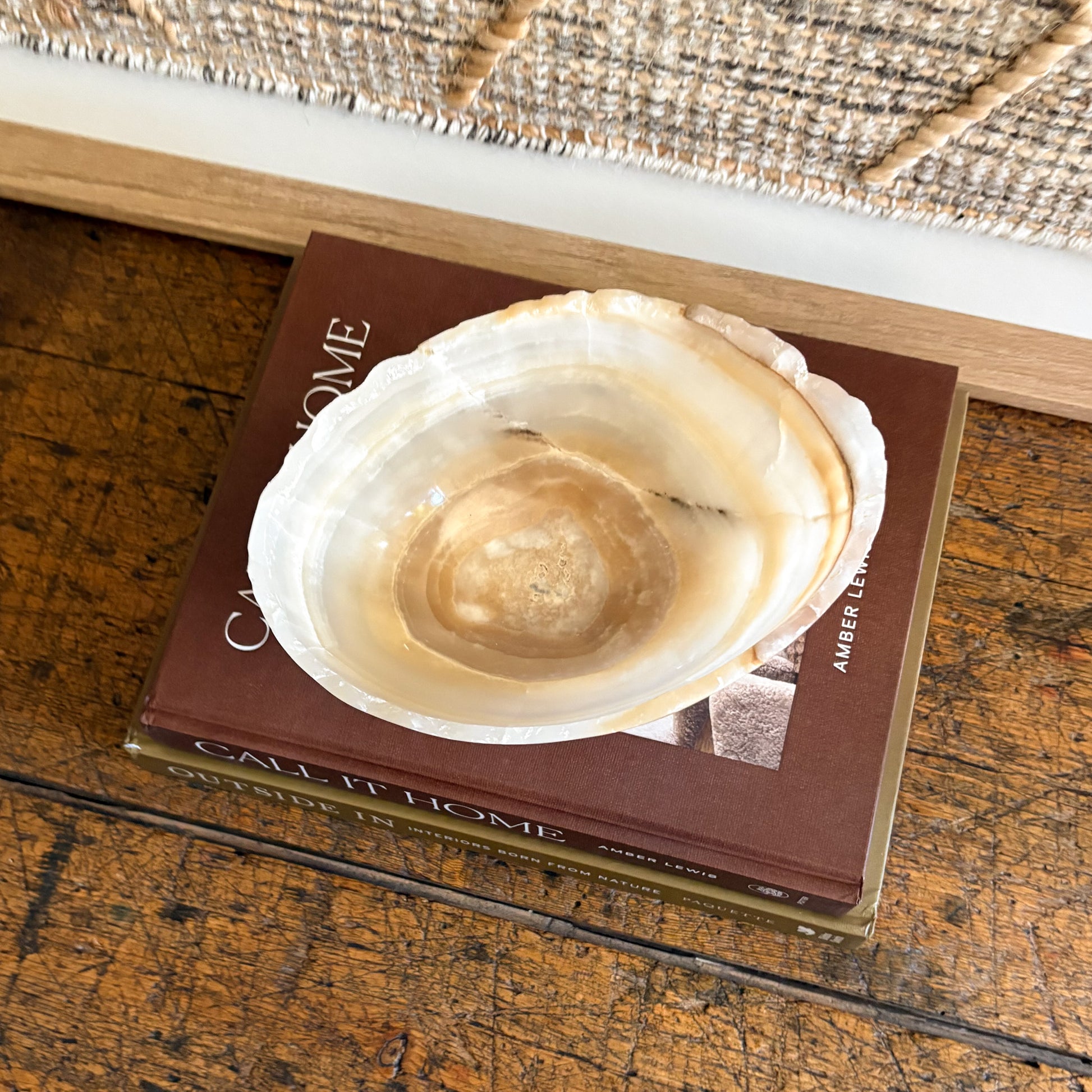 Top view of small hand carved amber onyx bowl - polished stone interior