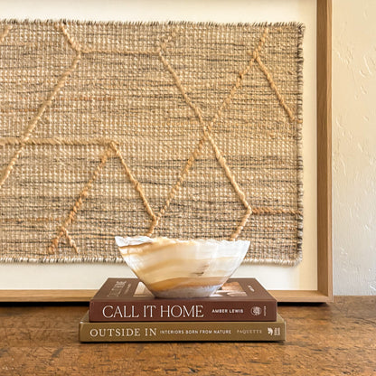 Small hand carved onyx bowl in amber honey color