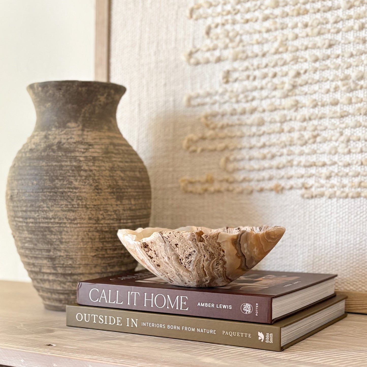Small hand-carved amber onyx bowl made from natural stone, polished finish.