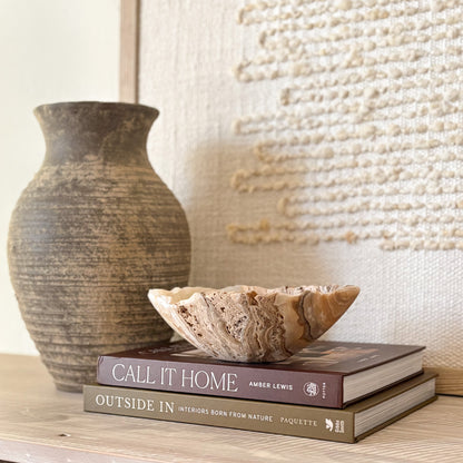 Small hand-carved amber onyx bowl made from natural stone, polished finish.