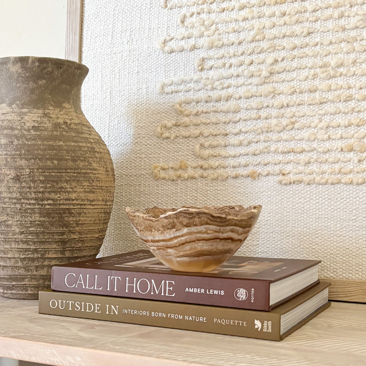 Hand carved small amber onyx stone bowl with natural translucent veining