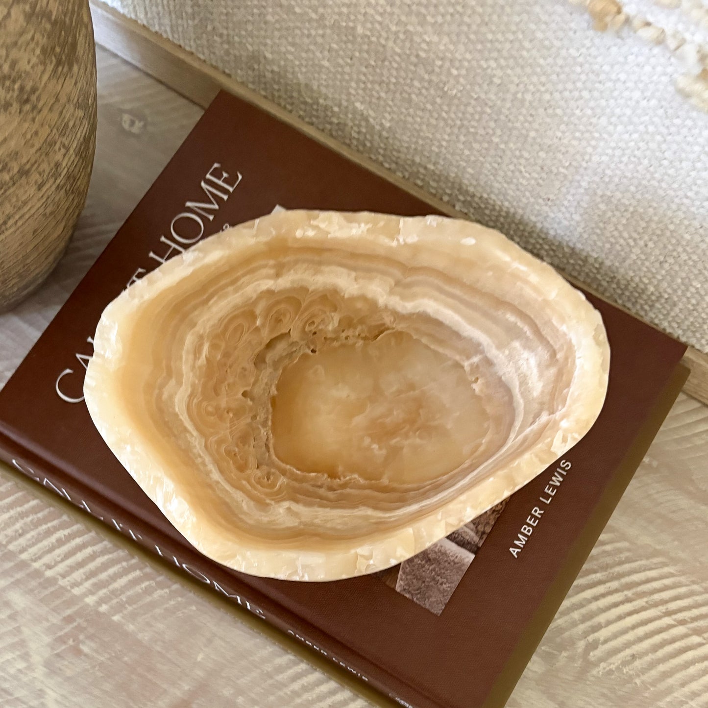 Small amber onyx bowl with hand-carved details, upscale home decor in natural stone