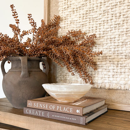 Small amber onyx bowl hand carved from natural stone, decorative tabletop accent