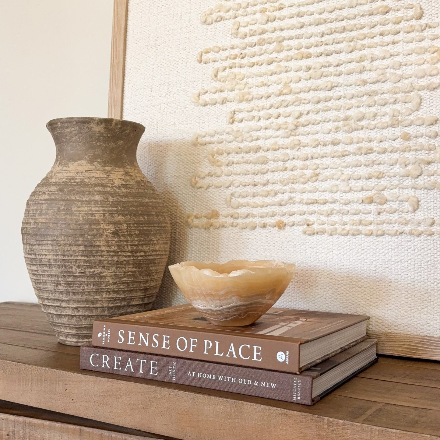 Handcrafted amber onyx stone bowl with smooth finish and natural mineral veining