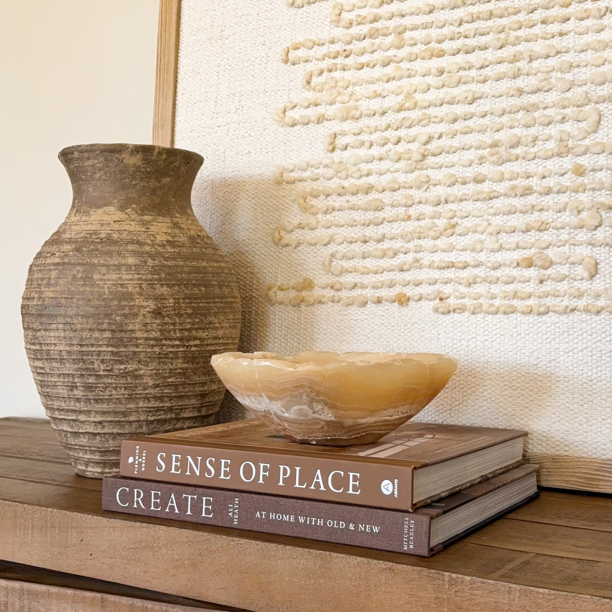 Artisan carved small onyx bowl in golden amber stone