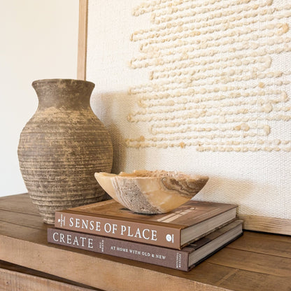 Genuine amber onyx crystal bowl with layered earth tone patterns