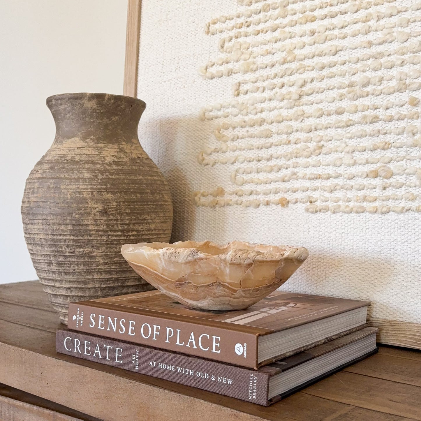 Artisan carved small onyx bowl in golden amber stone