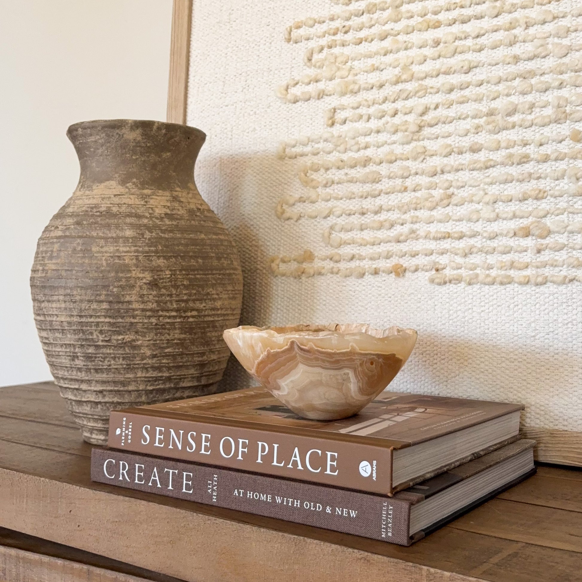 Handcrafted amber onyx stone bowl with smooth finish and natural mineral veining