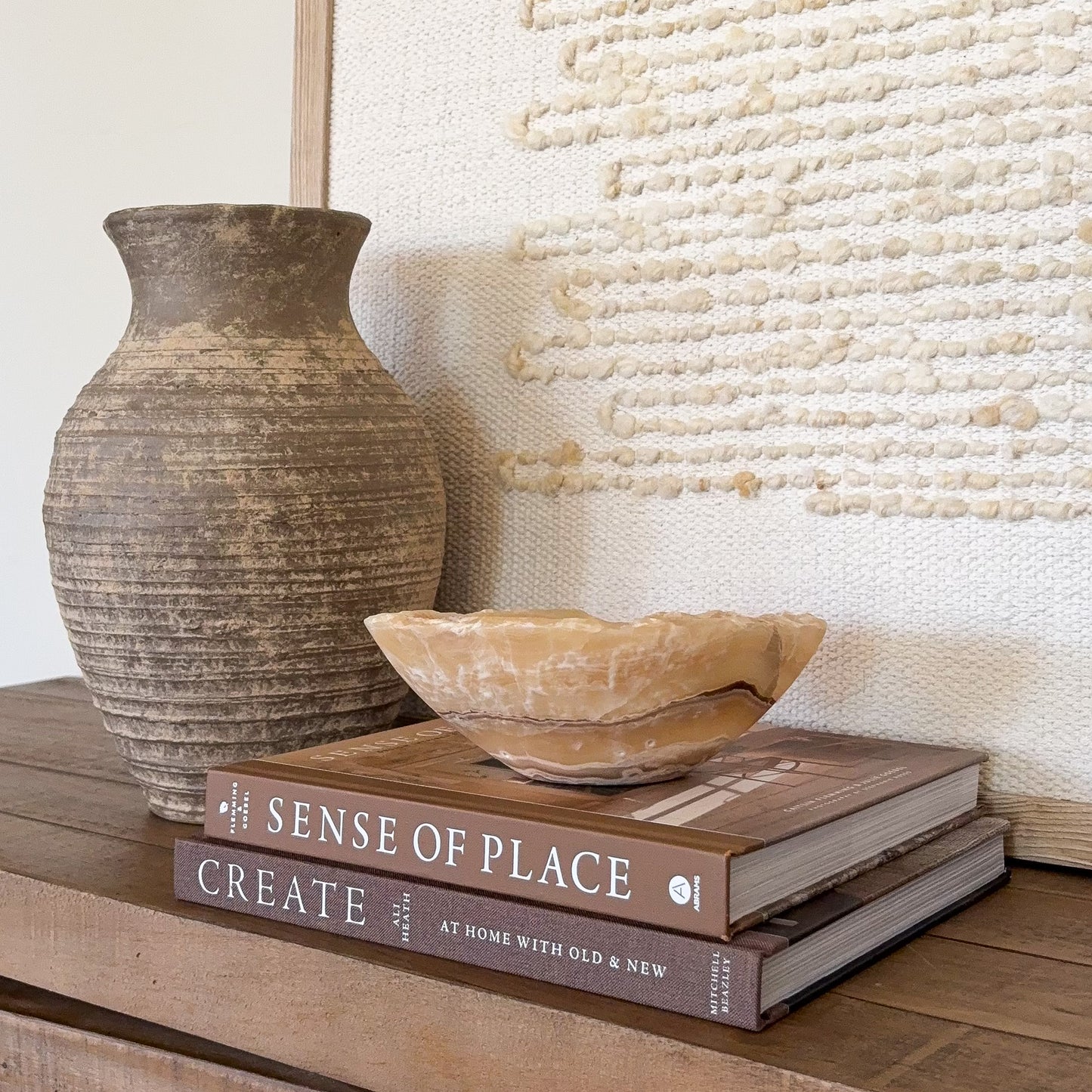 Handcrafted amber onyx stone bowl with smooth finish and natural mineral veining