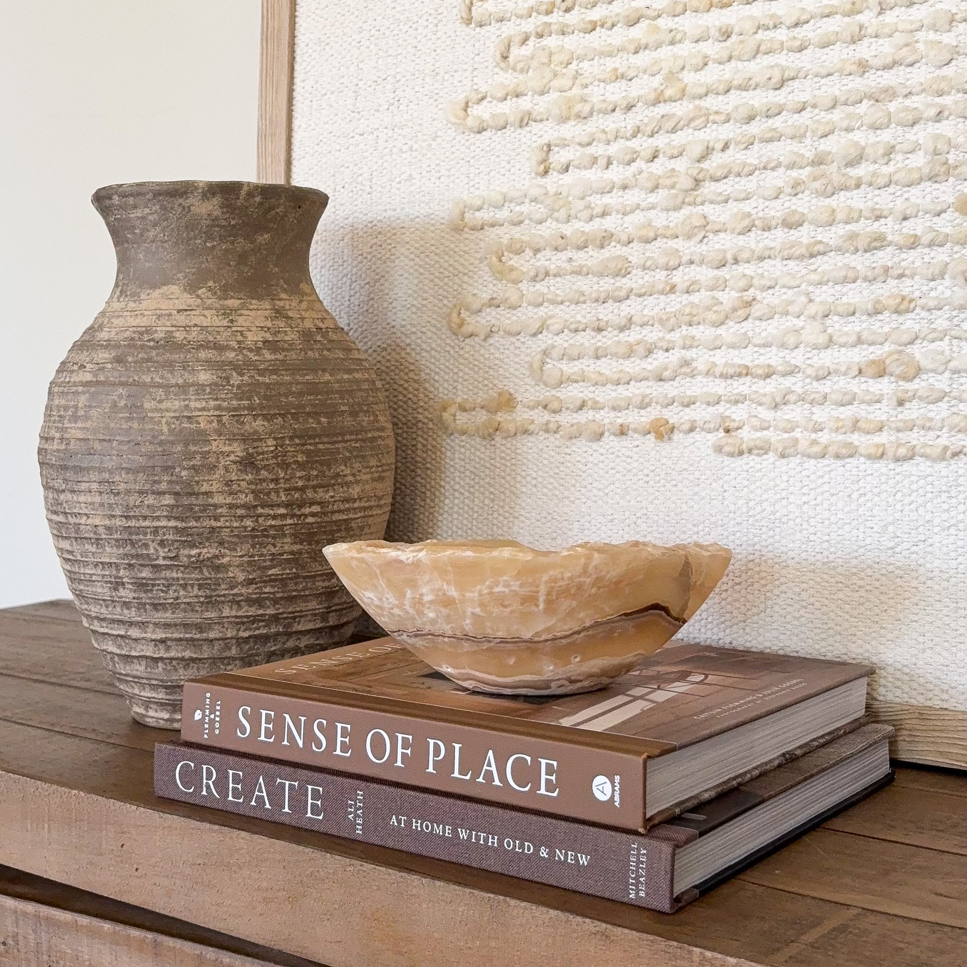 Handcrafted amber onyx stone bowl with smooth finish and natural mineral veining