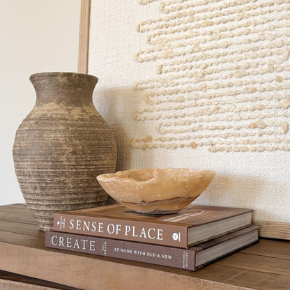 Genuine amber onyx crystal bowl with layered earth tone patterns