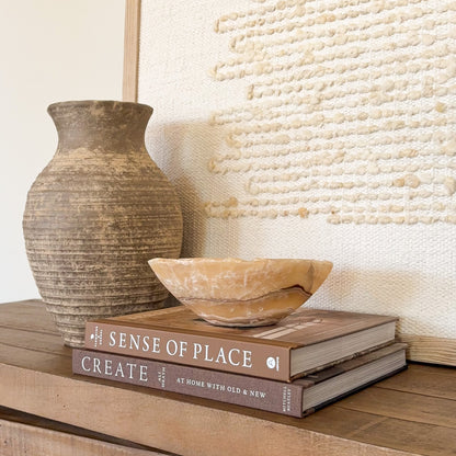 Artisan carved small onyx bowl in golden amber stone