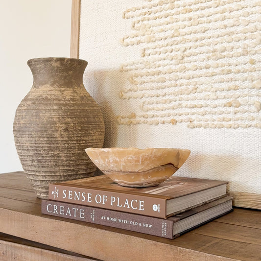 Artisan carved small onyx bowl in golden amber stone