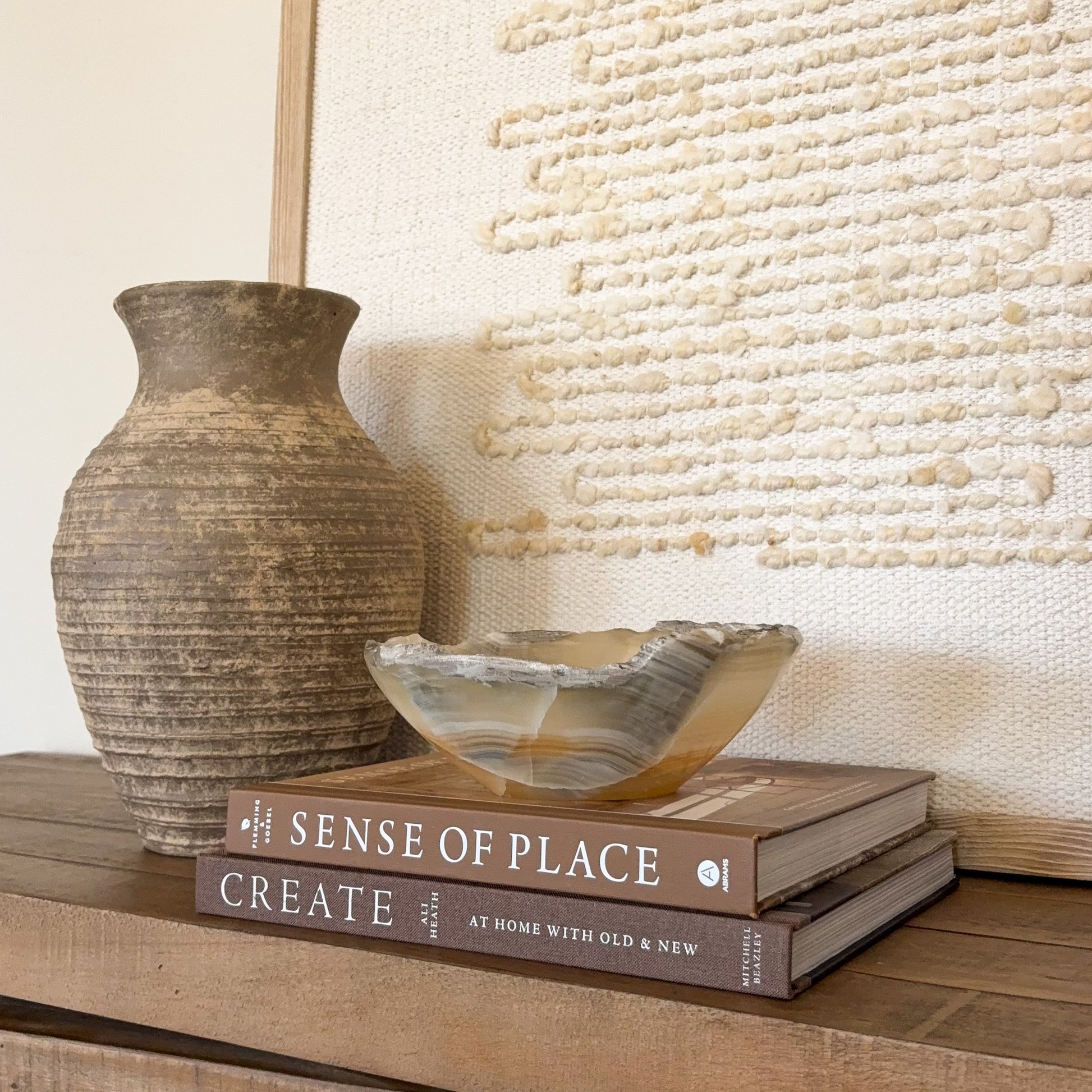 Handcrafted amber onyx stone bowl with smooth finish and natural mineral veining