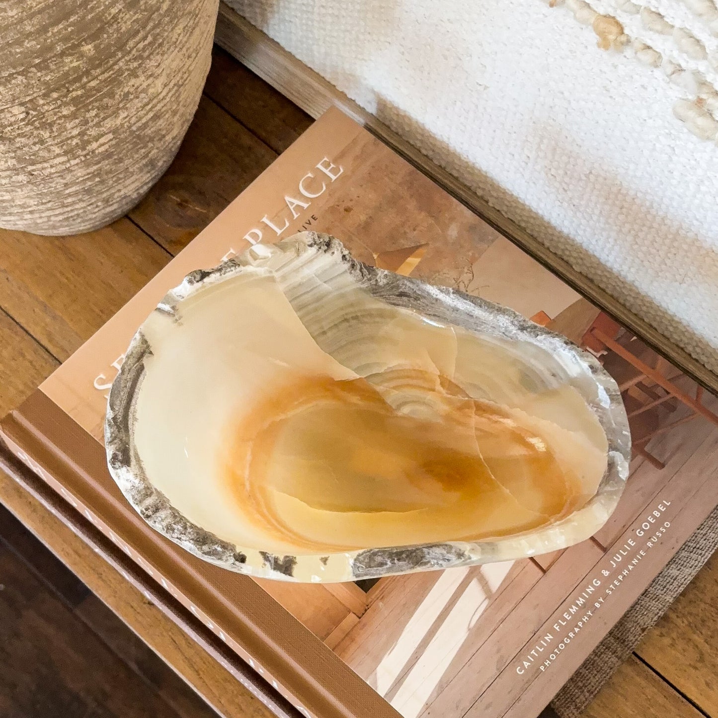 Small amber onyx bowl hand carved from natural stone with warm honey and cream banding